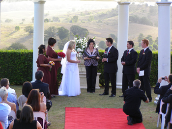 Kirsty & Vladimir exchange roses at their wedding with Marilyn Verschuure Marry Me Marilyn at the Glengariff Historic Estate and Winery in the Dayboro Valley north of Brisbane